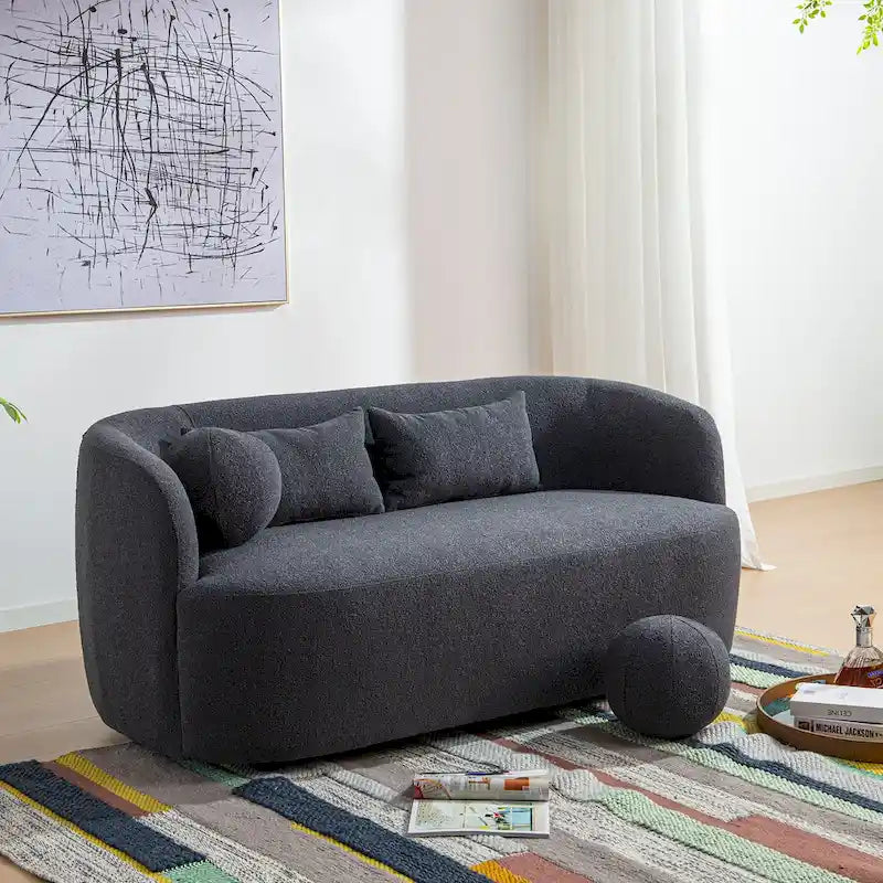 Causeuse 2 places en tissu bouclé avec oreillers