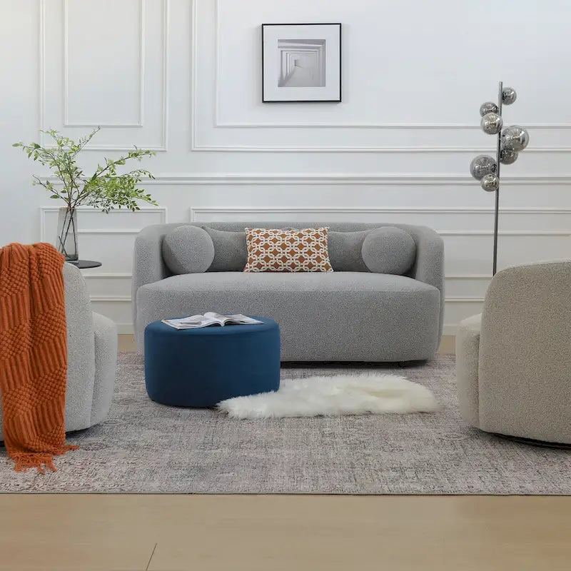 Causeuse 2 places en tissu bouclé avec oreillers