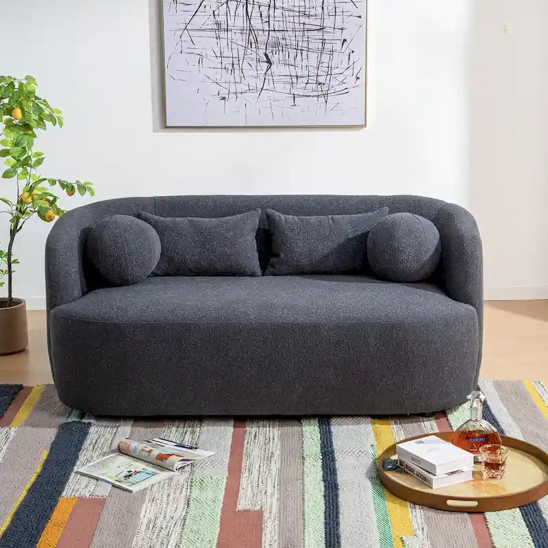 Causeuse 2 places en tissu bouclé avec oreillers