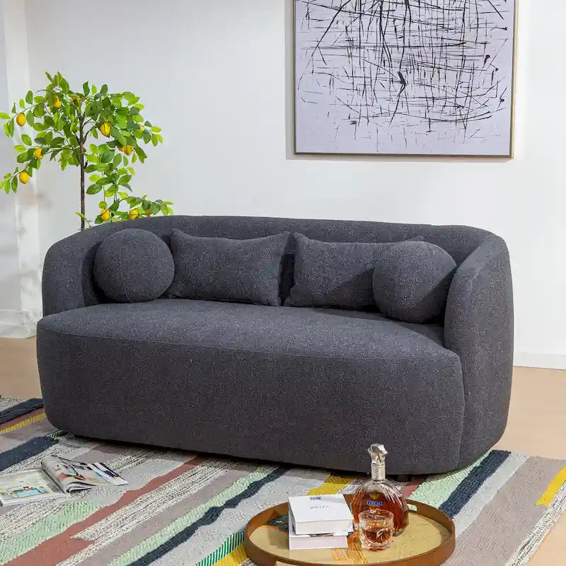Causeuse 2 places en tissu bouclé avec oreillers