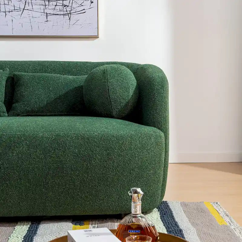 Causeuse 2 places en tissu bouclé avec oreillers