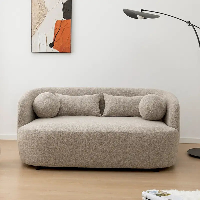 Causeuse 2 places en tissu bouclé avec oreillers