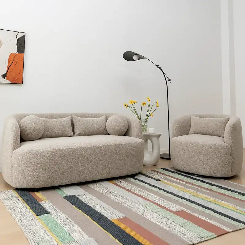 Causeuse 2 places en tissu bouclé avec oreillers