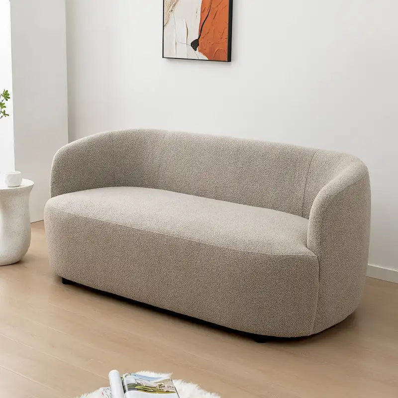 Causeuse 2 places en tissu bouclé avec oreillers