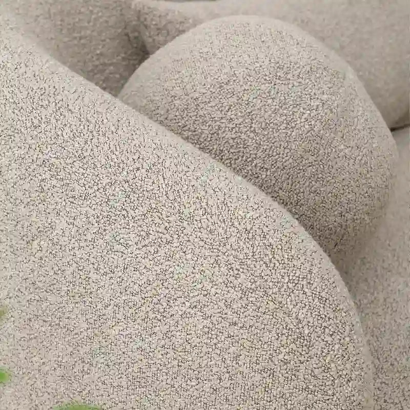 Causeuse 2 places en tissu bouclé avec oreillers