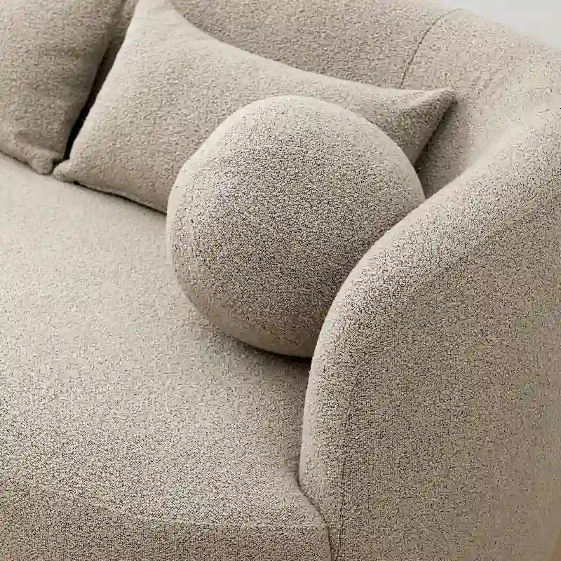 Causeuse 2 places en tissu bouclé avec oreillers