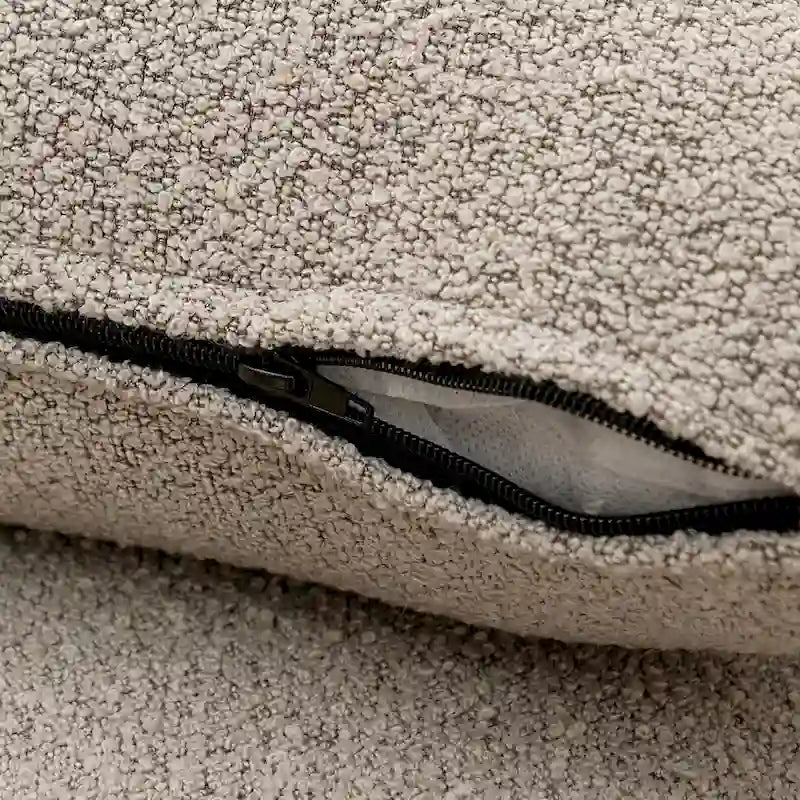 Causeuse 2 places en tissu bouclé avec oreillers